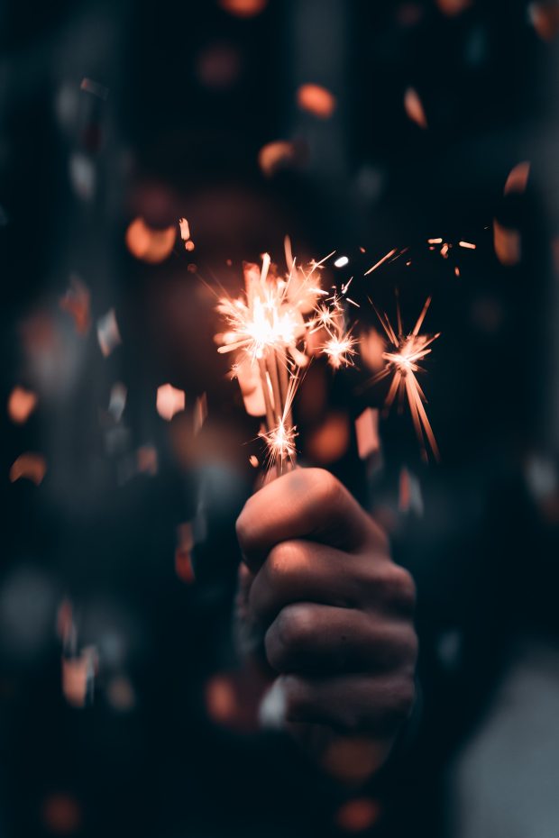 person-holding-a-sparkler-in-macro-photography-3264533